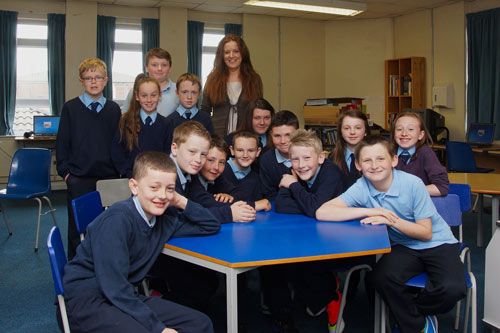 Malcolm Turner and Marbeth Scott volunteers at St. Matthew's Primary School in Belfast, teaching basic IT skills on a 1-1 basis.