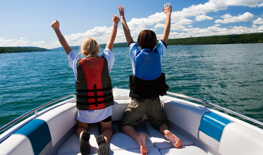Brother & Sister enjoy riding on boat together