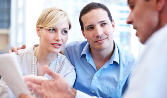Couple asking an Allstate agent about adding renters insurance to their auto policy