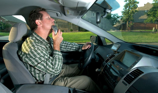 Tips to help you eliminate distracted driving. Man using electric shaver while driving