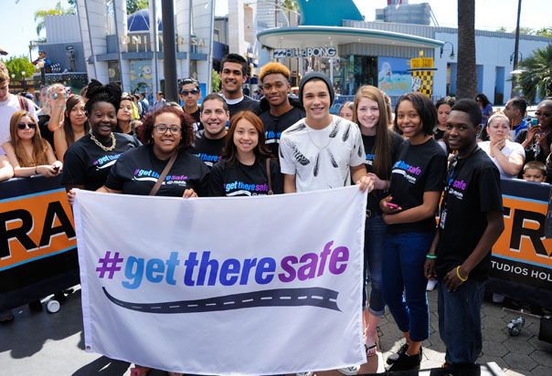 Teens holding banner. 