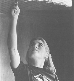 Volunteer working on ceiling. 