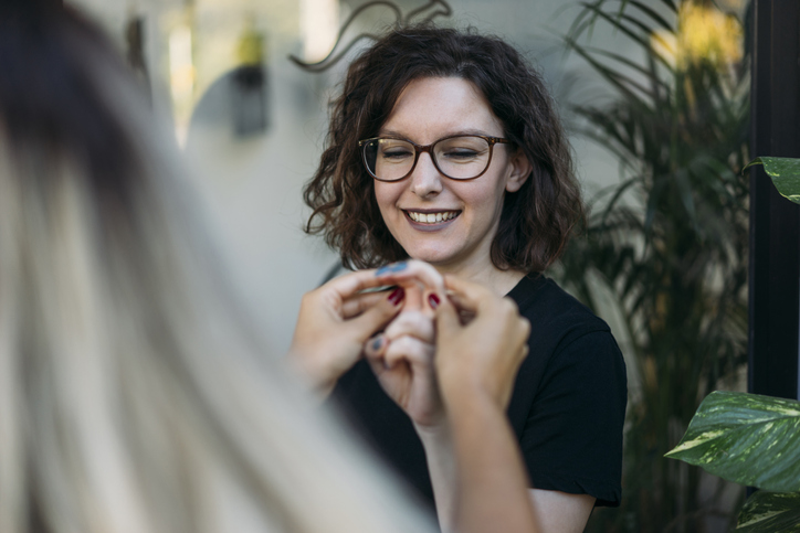 Woman with glasses.