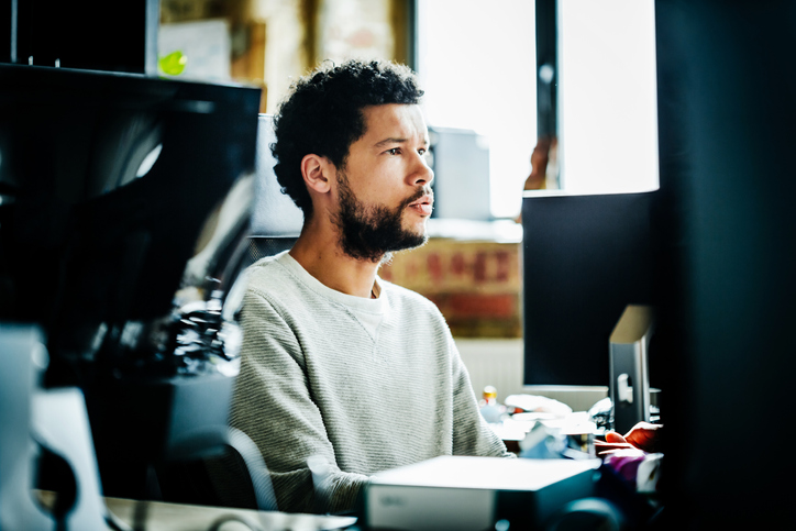Man sitting in front of a computer