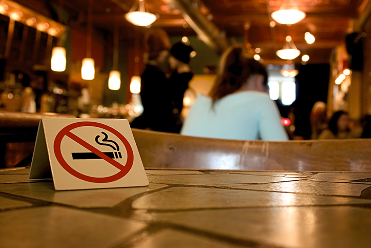 Closeup of a no-smoking sign on a table in a restaurant.