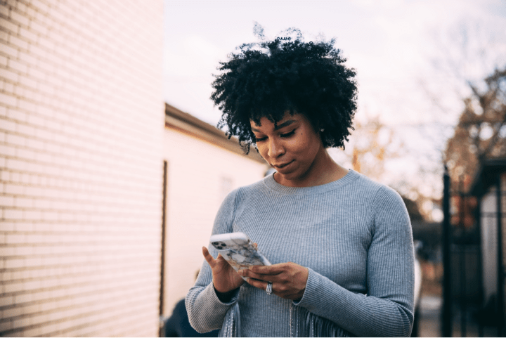 Lady using cell phone.