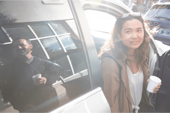 Woman exiting car.