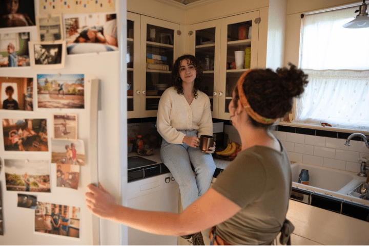 Woman looking in refrigerator. 