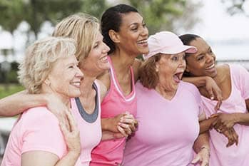 A group of women wearing pink.