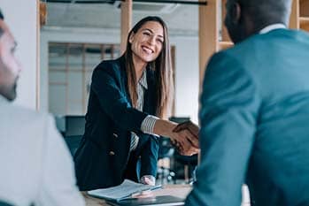Business partners shaking hands.