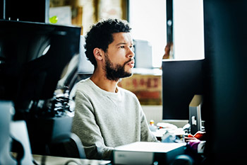 Man sitting in front of a computer