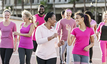 Group of people wearing pink clothes.