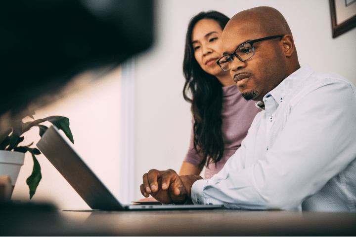 Man and woman on computer. 