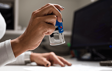 A woman looks over a claim in an office. 