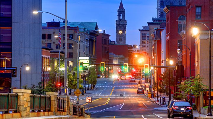 image of cars driving downtown. 