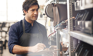 man working in hardware store. 