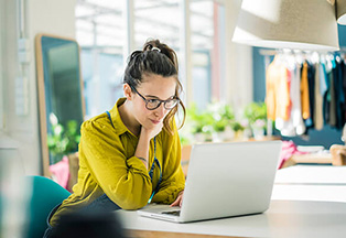 Woman looking at her computer.