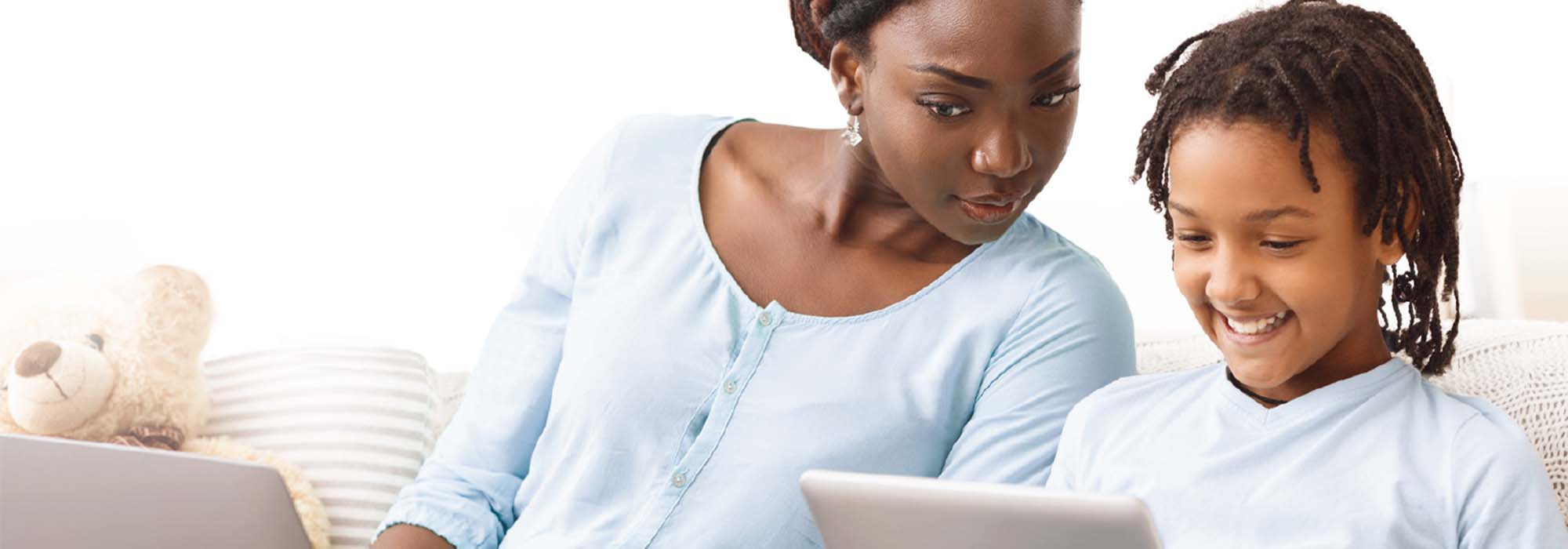 A parent looking at her child laptop screen.  