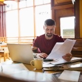 Business owner using calculator. 