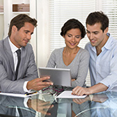 Couple meeting with insurance agent. 