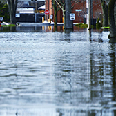 Flooded street with car. 