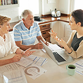 Older couple talking finances. 