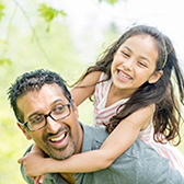 Dad giving piggy back ride thinking about Life Insurance Review plans with Chula Vista Allstate Agent Life Insurance with trusted California Licensed Insurance Agency Owner and Advisor Jason Raya in Chula Vista San Diego California. 