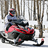 Person on red snowmobile. 