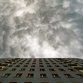 Dark clouds above apartment building 