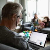 Man reviewing finances on computer. 