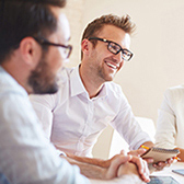 Young professional meeting at table. 