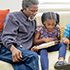 Grandparents reading to grandkids. 