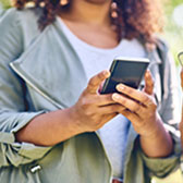 Woman using mobile phone. 