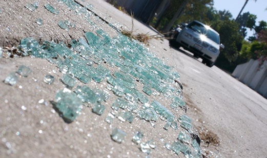 Broken glass on the payment, a car being stolen.