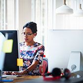 Woman browsing an office computer
